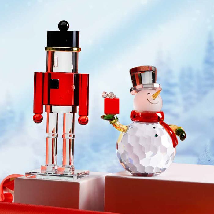 Schiaccianoci e pupazzo di neve in cristallo decorativi